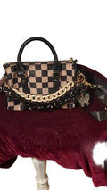 Black and tan checkered purse