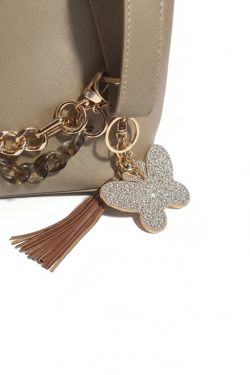Gold shoulder purse w/bagchains, butterfly keychain/bagcharm and tassle bagcharm all included